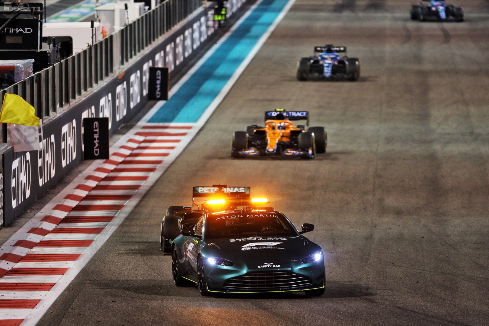 Lewis Hamilton (GBR) Mercedes AMG F1 W12 leads behind the Aston Martin FIA Safety Car.