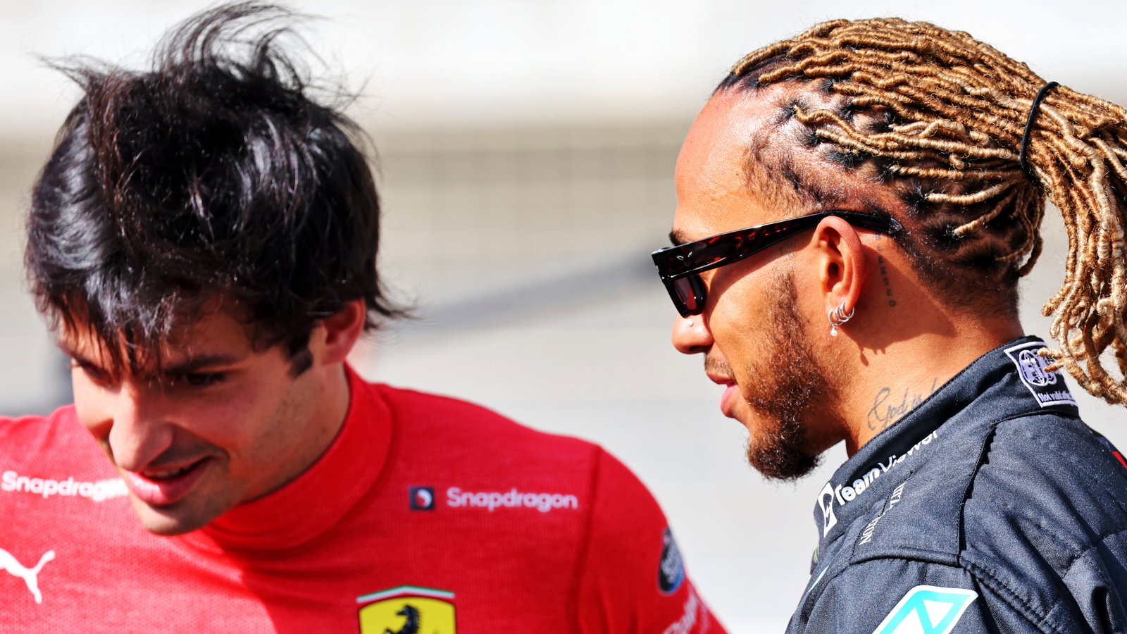 Lewis Hamilton (GBR) Mercedes AMG F1 with Carlos Sainz Jr (ESP) Ferrari.
