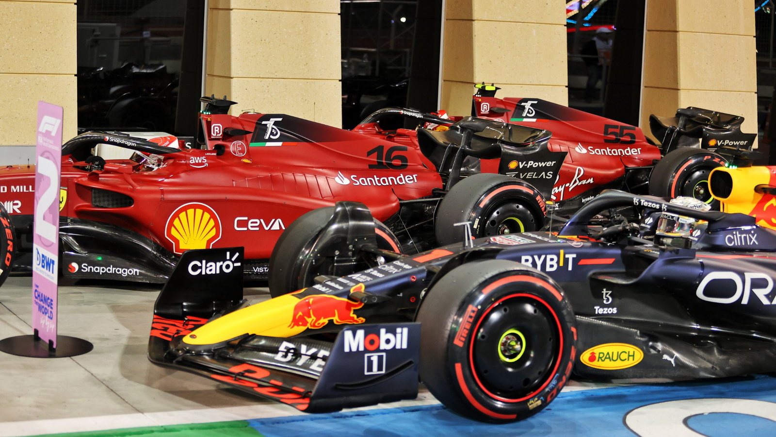Max Verstappen (NLD) Red Bull Racing RB18 and pole sitter Charles Leclerc (MON) Ferrari F1-75 in qualifying parc ferme.