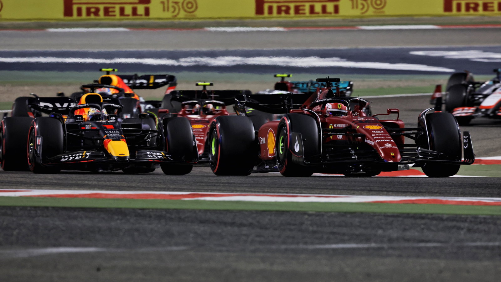 Charles Leclerc (MON) Ferrari F1-75 leads at the start of the race.