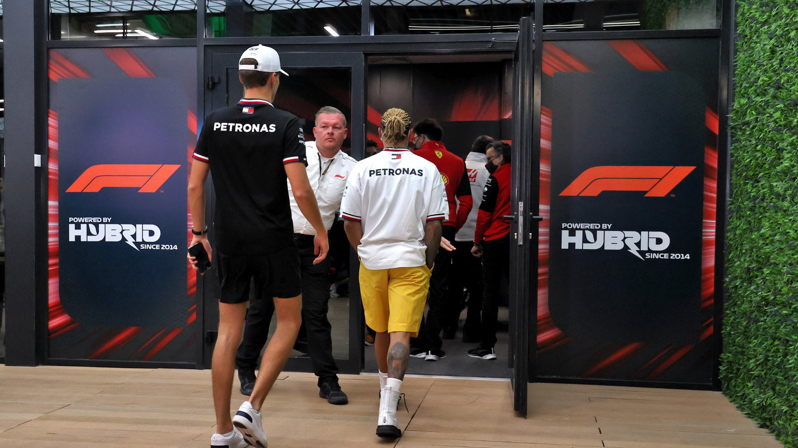 George Russell (GBR) Mercedes AMG F1 and Lewis Hamilton (GBR) Mercedes AMG F1 at a meeting following