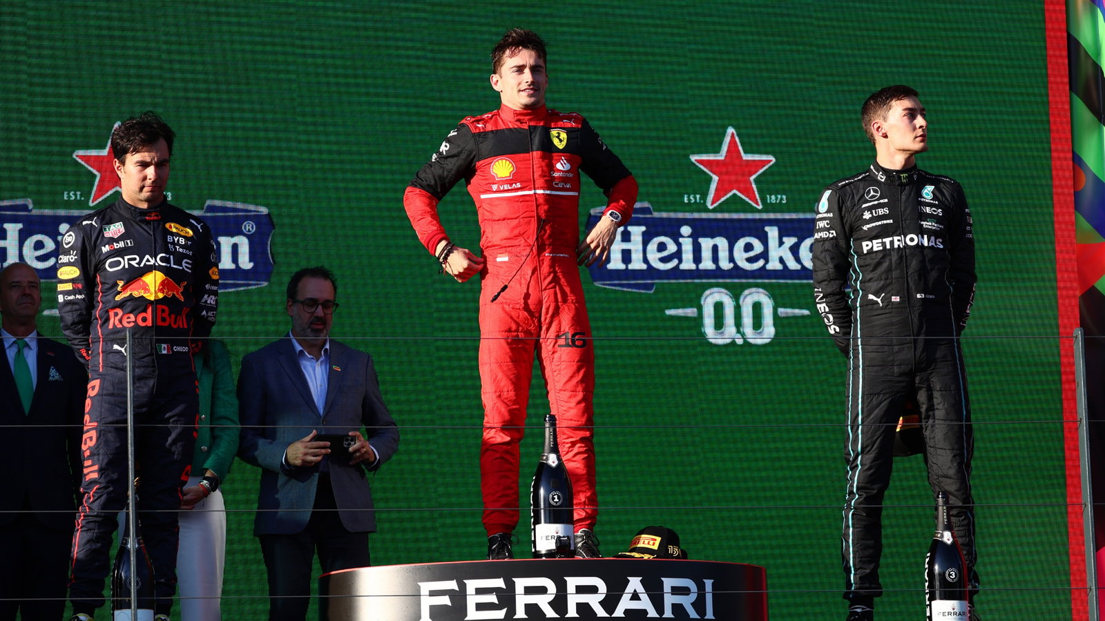 1st place Charles Leclerc (MON) Ferrari F1-75 with 2nd place Sergio Perez (MEX) Red Bull Racing RB18 and 3rd place George