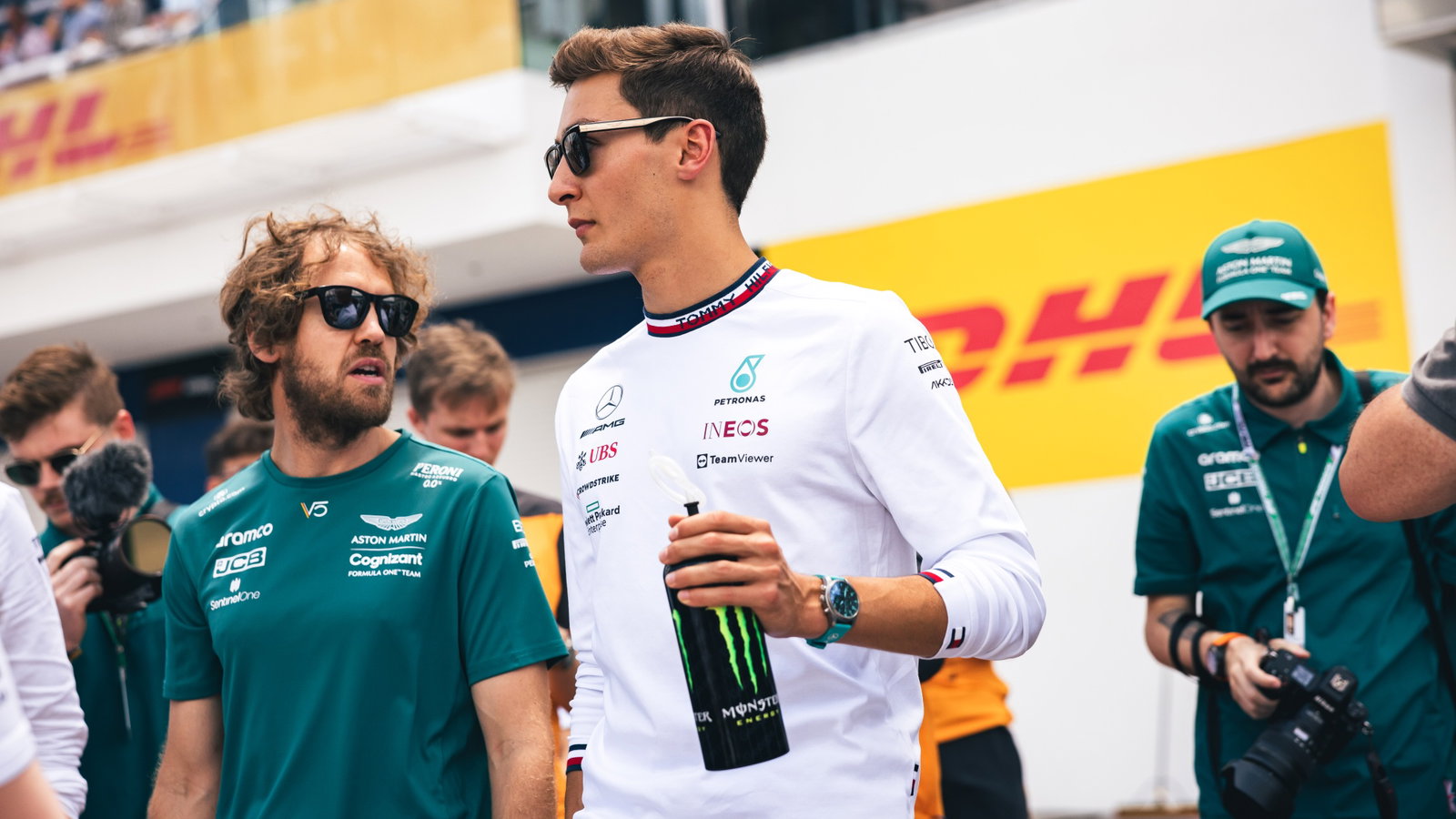 (L to R): Sebastian Vettel (GER) Aston Martin F1 Team with George Russell (GBR) Mercedes AMG F1 on the drivers parade.