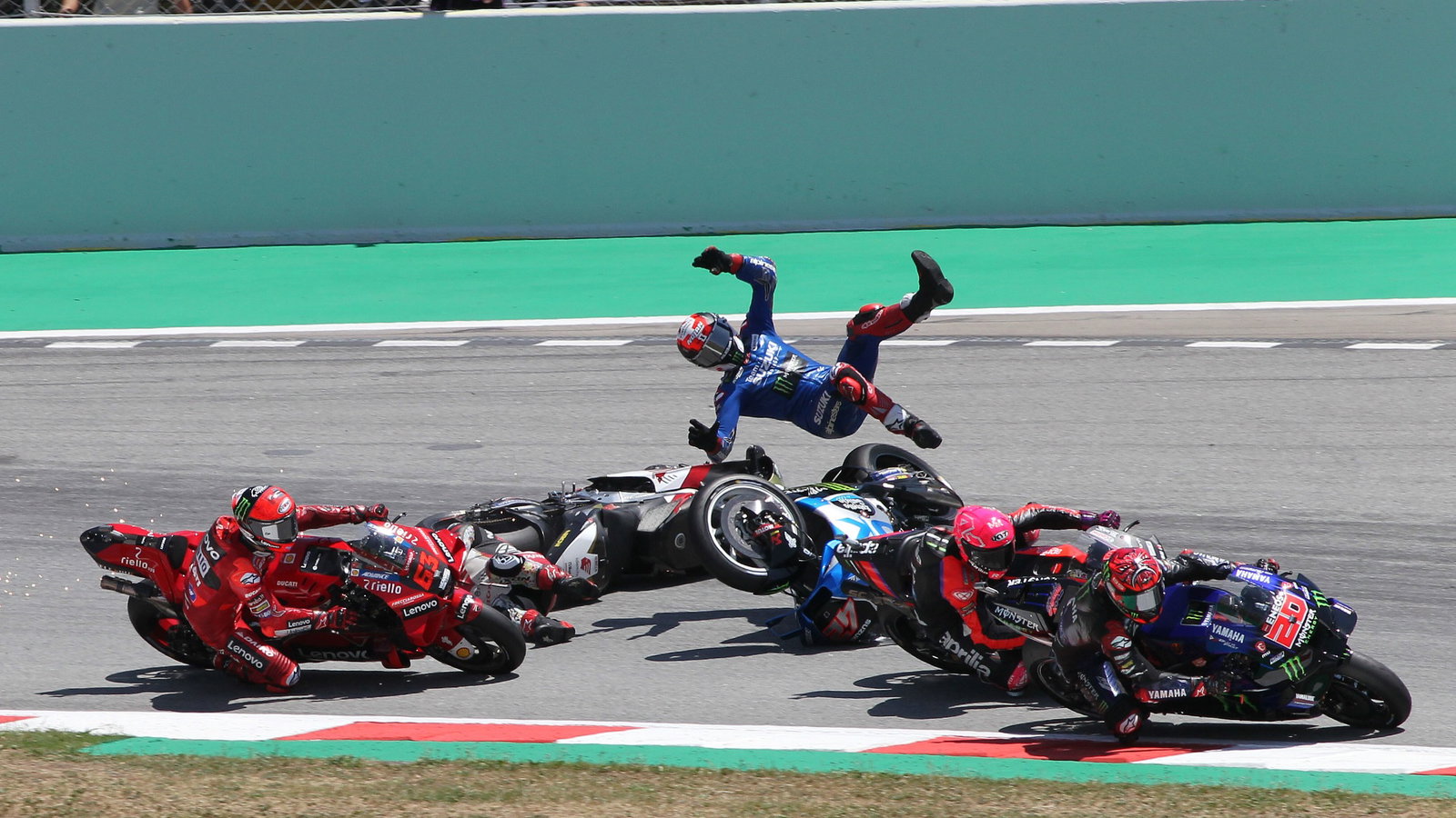  Takaaki Nakagami and Alex Rins crash, Francesco Bagnaia behind, Catalunya MotoGP. 5 July