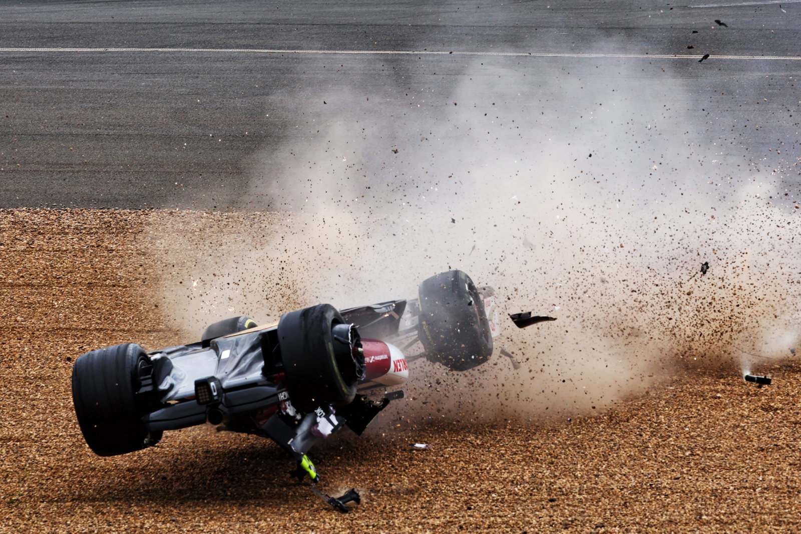 Guanyu Zhou (CHN) Alfa Romeo F1 Team C42 crashes at the start of the race. Formula 1 World Championship, Rd 10, British