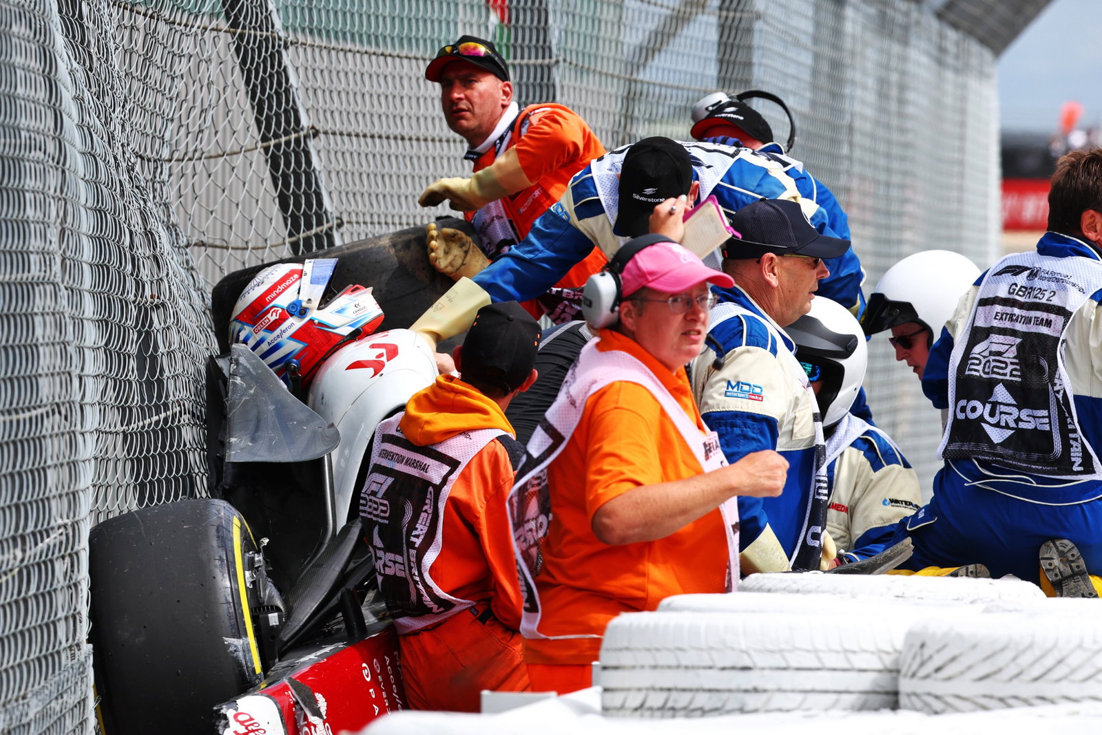 Guanyu Zhou (CHN) is extracted from his Alfa Romeo F1 Team C42 after he crashed at the start of the race. Formula 1 World