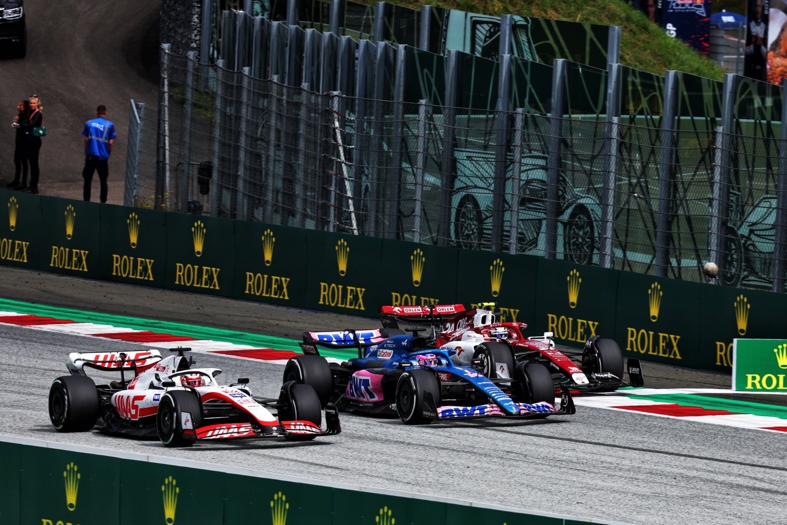 (L to R): Kevin Magnussen (DEN) Haas VF-22; Fernando Alonso (ESP) Alpine F1 Team A522; and Guanyu Zhou (CHN) Alfa Romeo F1