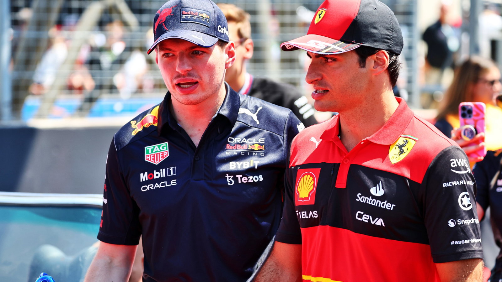 (L to R): Max Verstappen (NLD) Red Bull Racing and Carlos Sainz Jr (ESP) Ferrari on the drivers parade. Formula 1 World