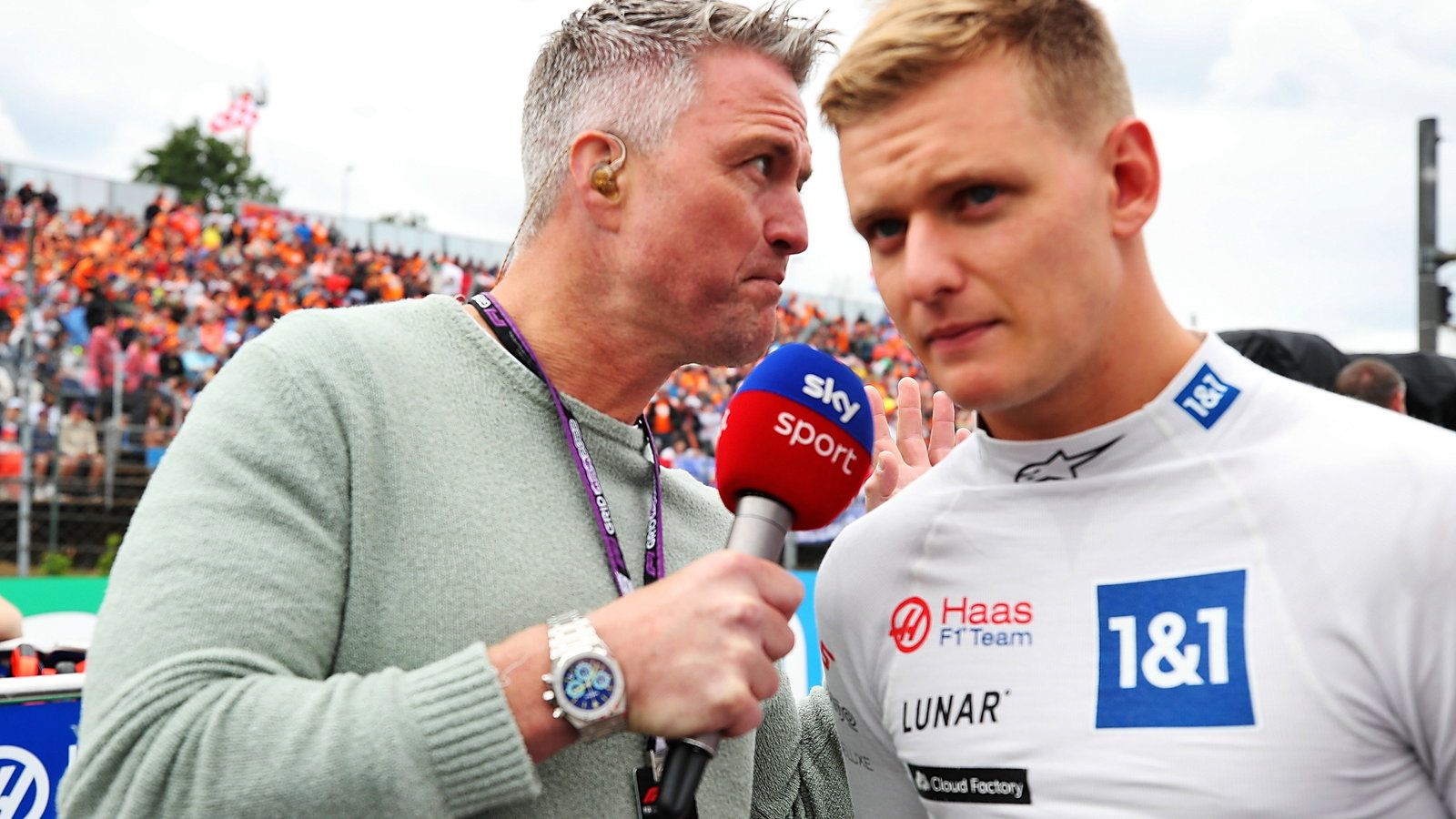 (L to R): Ralf Schumacher (GER) Sky Sport Presenter with Mick Schumacher (GER) Haas F1 Team on the grid. Formula 1 World