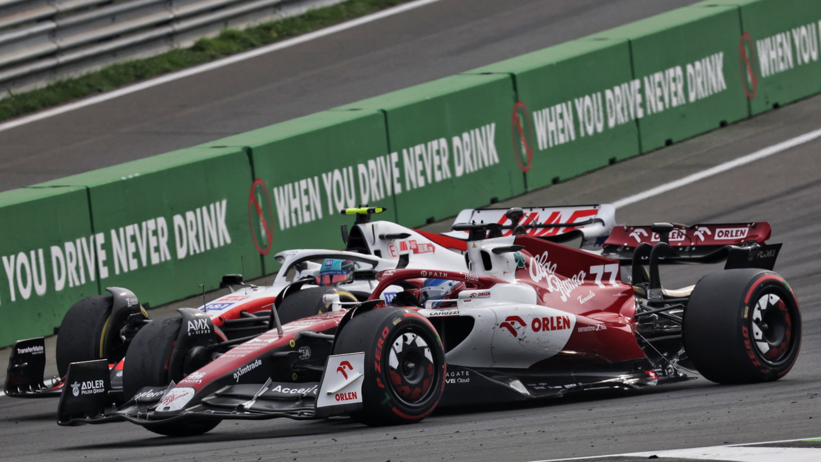 Mick Schumacher (GER) Haas VF-22 and Valtteri Bottas (FIN) Alfa Romeo F1 Team C42 battle for position. Formula 1 World