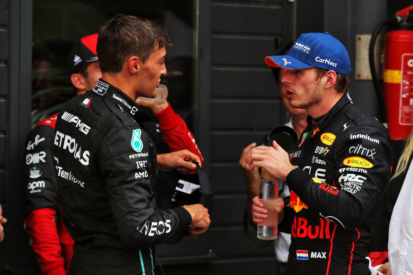 (L to R): George Russell (GBR) Mercedes AMG F1 with Max Verstappen (NLD) Red Bull Racing in parc ferme. Formula 1 World