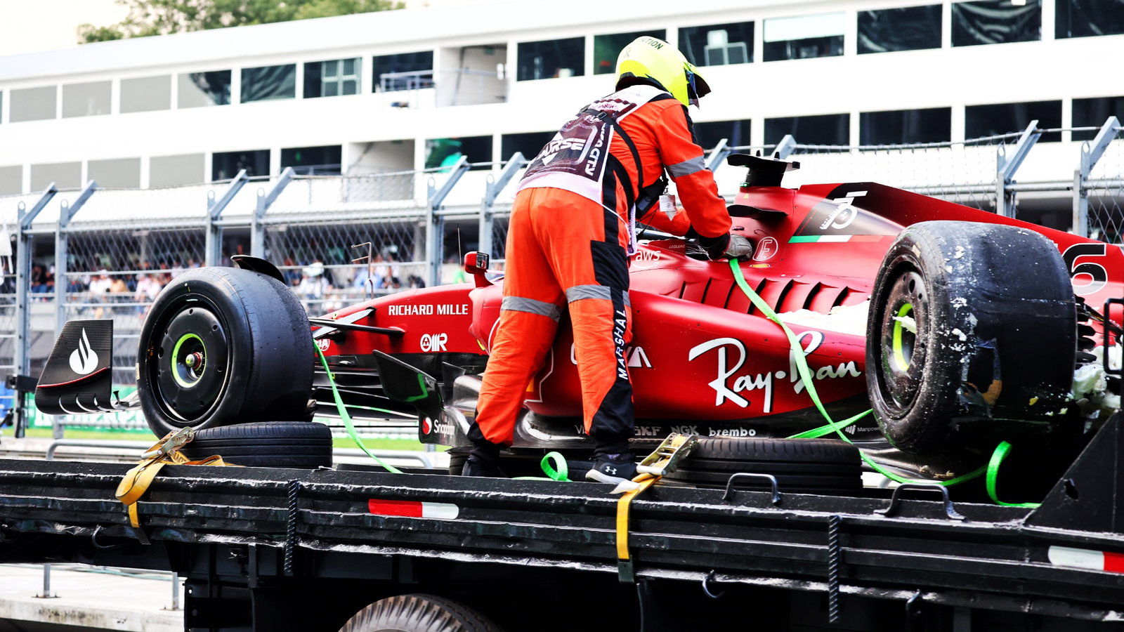 The damaged Ferrari F1-75 of Charles Leclerc (MON) Ferrari is recovered back to the pits on the back of a truck in the