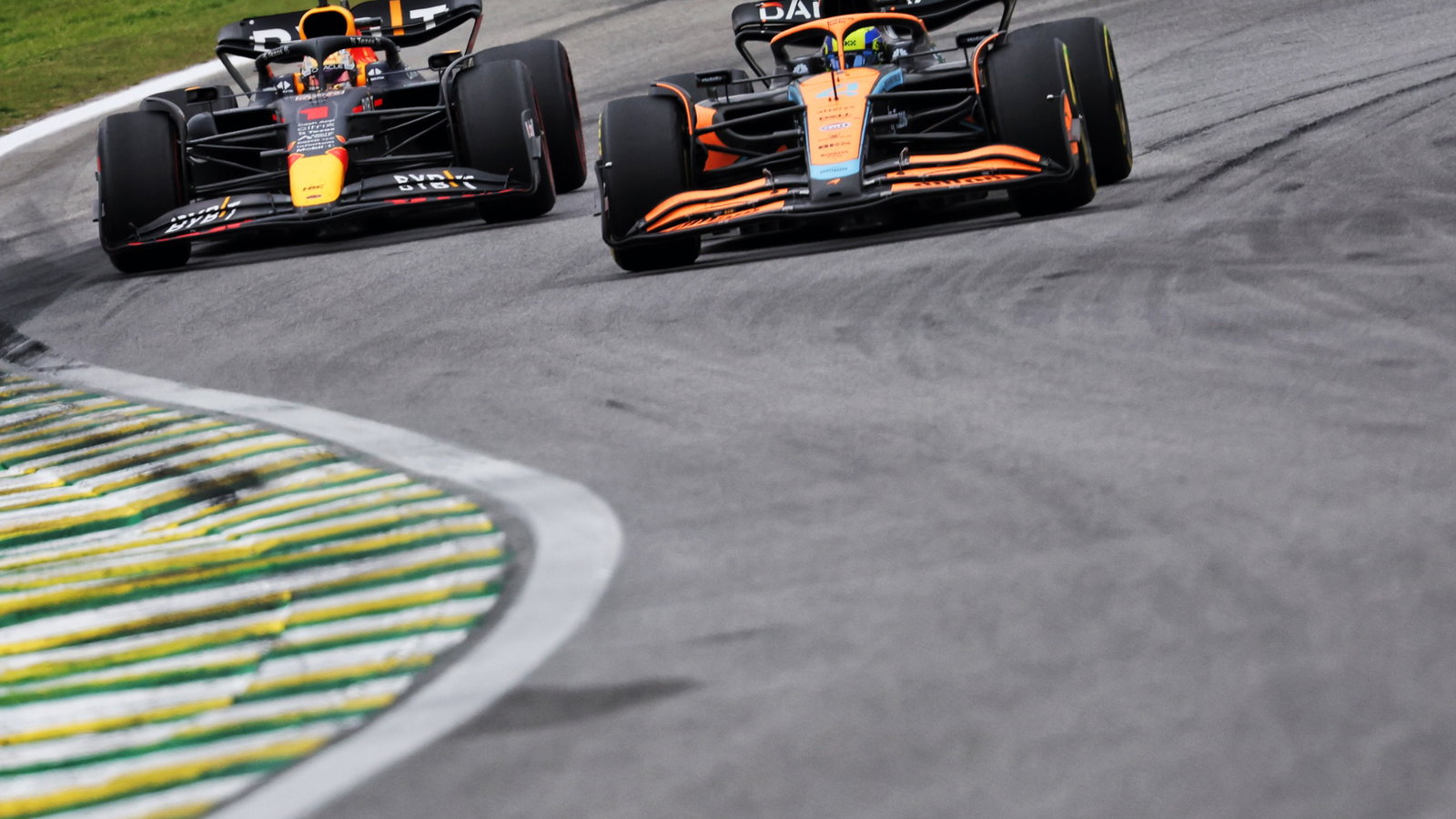 Lando Norris (GBR) McLaren MCL36 and Max Verstappen (NLD) Red Bull Racing RB18. Formula 1 World Championship, Rd 21,