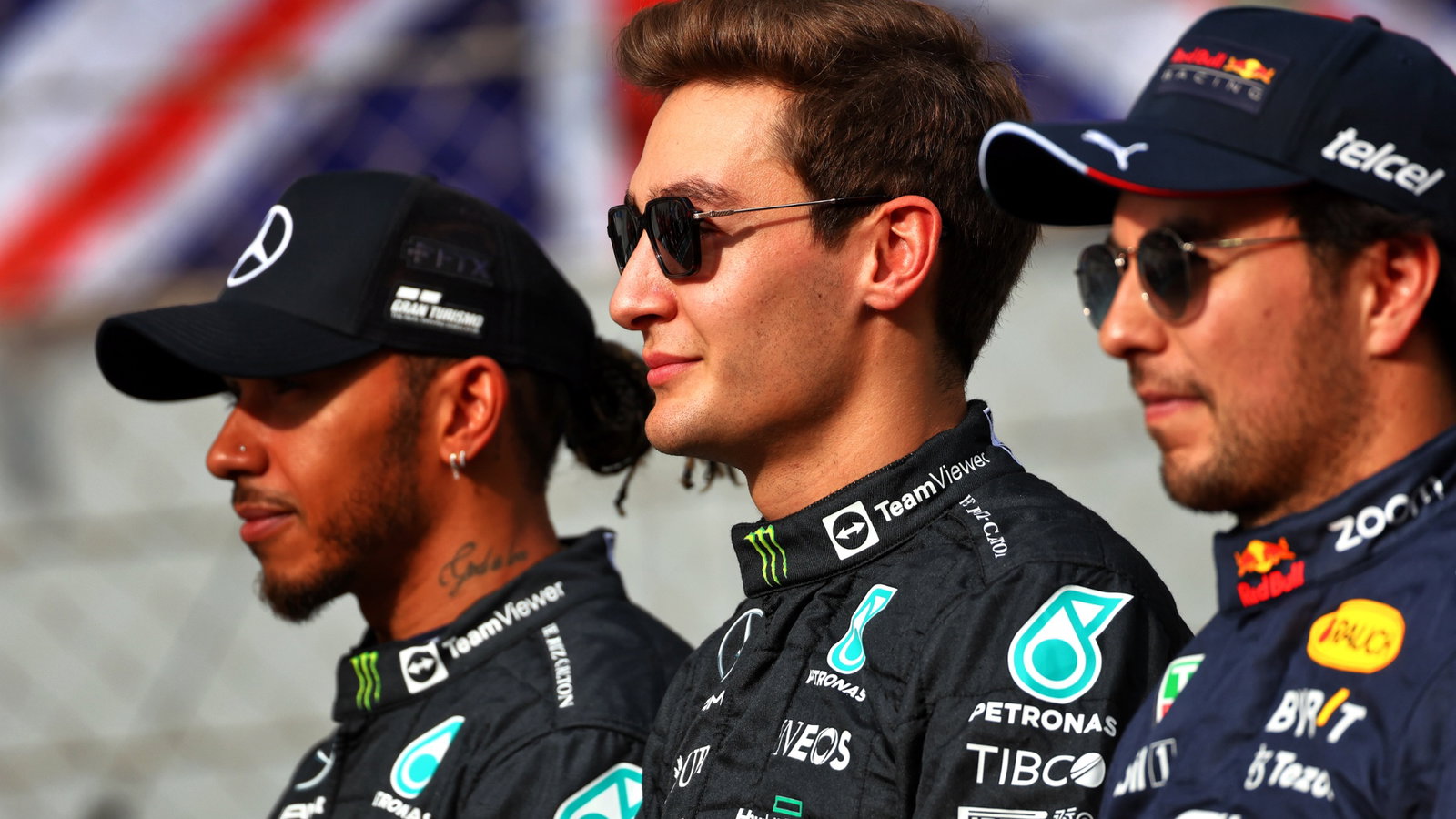 George Russell (GBR) Mercedes AMG F1 with Lewis Hamilton (GBR) Mercedes AMG F1 and Sergio Perez (MEX) Red Bull Racing at the