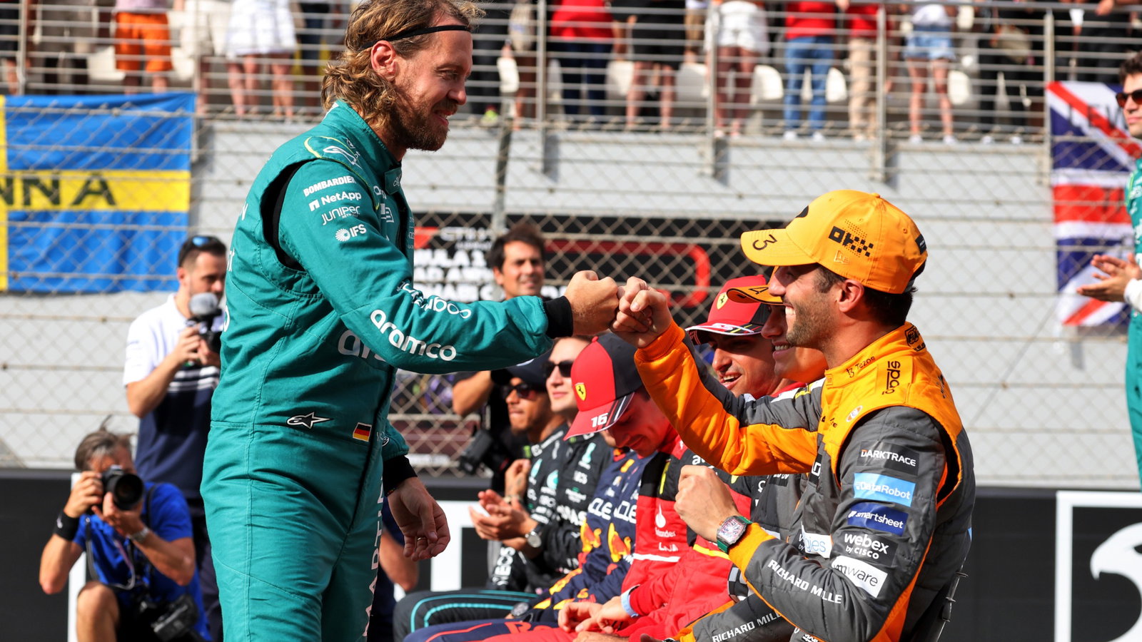 Sebastian Vettel (GER) Aston Martin F1 Team with Daniel Ricciardo (AUS) McLaren at the drivers end of season group