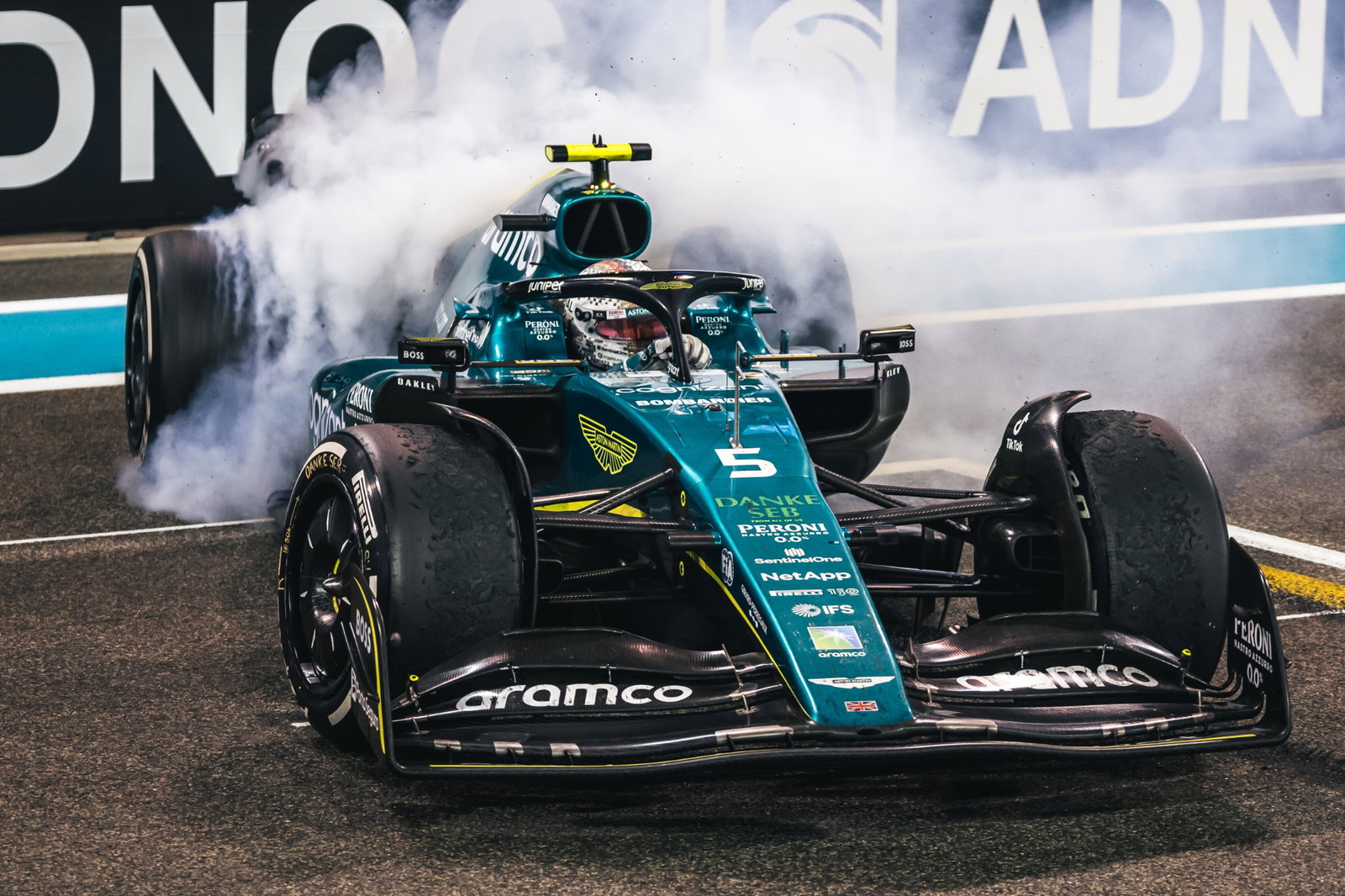 Sebastian Vettel (GER) Aston Martin F1 Team AMR22 - donuts at the end of the race. Formula 1 World Championship, Rd 22,