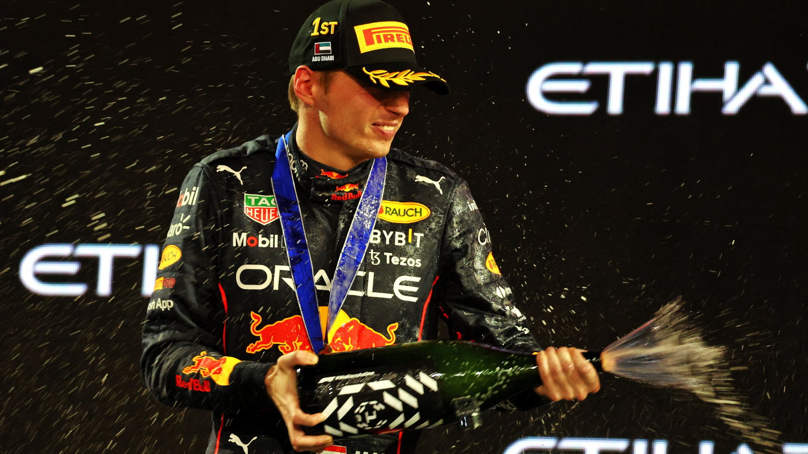 Race winner Max Verstappen (NLD) Red Bull Racing celebrates on the podium. Formula 1 World Championship, Rd 22, Abu Dhabi