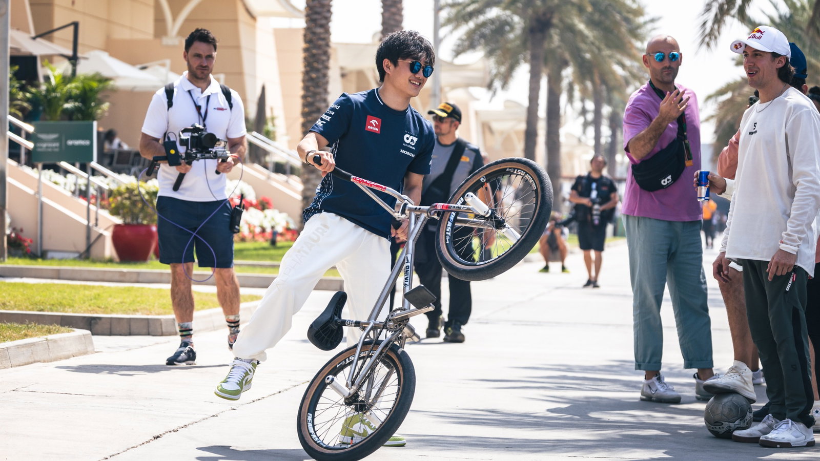 Yuki Tsunoda (JPN) AlphaTauri on a BMX bike. Formula 1 World Championship, Rd 1, Bahrain Grand Prix, Sakhir, Bahrain,