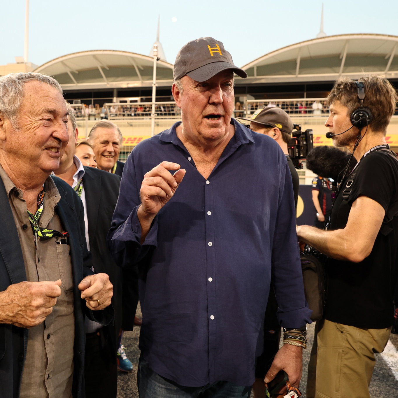 Jeremy Clarkson (GBR) TV Presenter with Nick Mason (GBR) Pink Floyd Drummer on the grid. Formula 1 World Championship, Rd