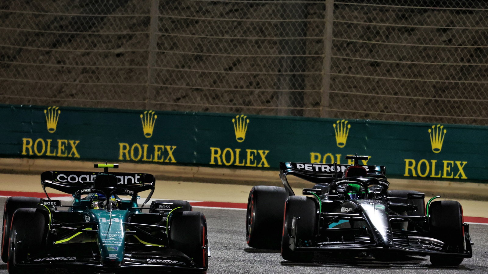 Fernando Alonso (ESP) Aston Martin F1 Team AMR23 and George Russell (GBR) Mercedes AMG F1 W14 battle for position. Formula