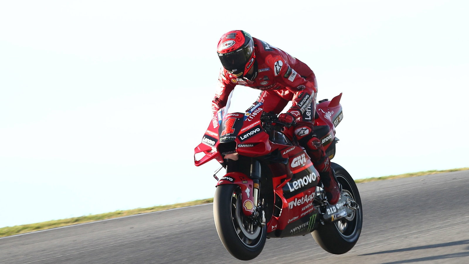 Francesco Bagnaia, both wheels in the air, Portimao MotoGP test, 11 March
