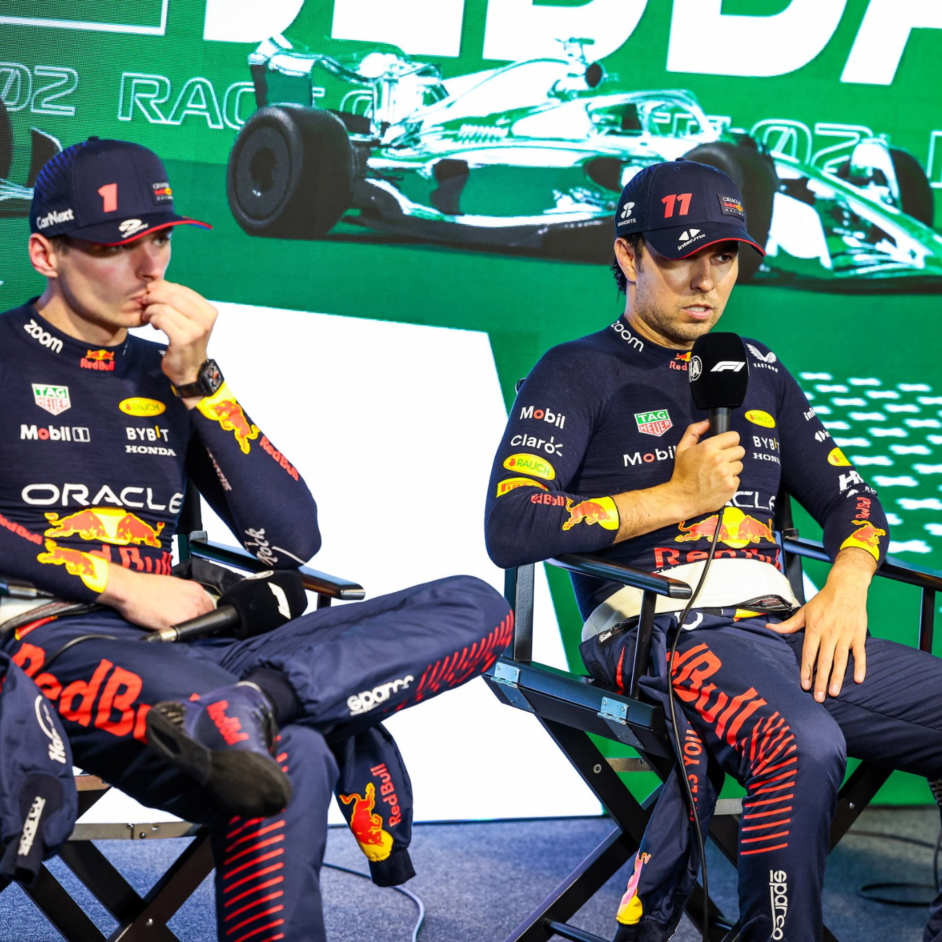 (L to R): Max Verstappen (NLD) Red Bull Racing and race winner Sergio Perez (MEX) Red Bull Racing in the the post race FIA