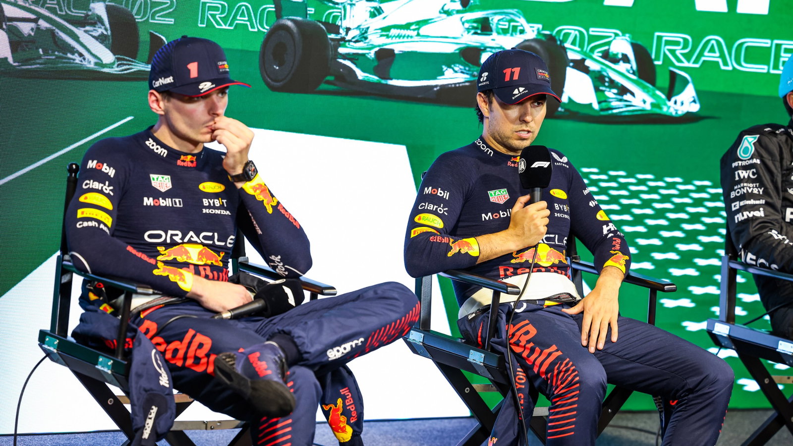 (L to R): Max Verstappen (NLD) Red Bull Racing and race winner Sergio Perez (MEX) Red Bull Racing in the the post race FIA