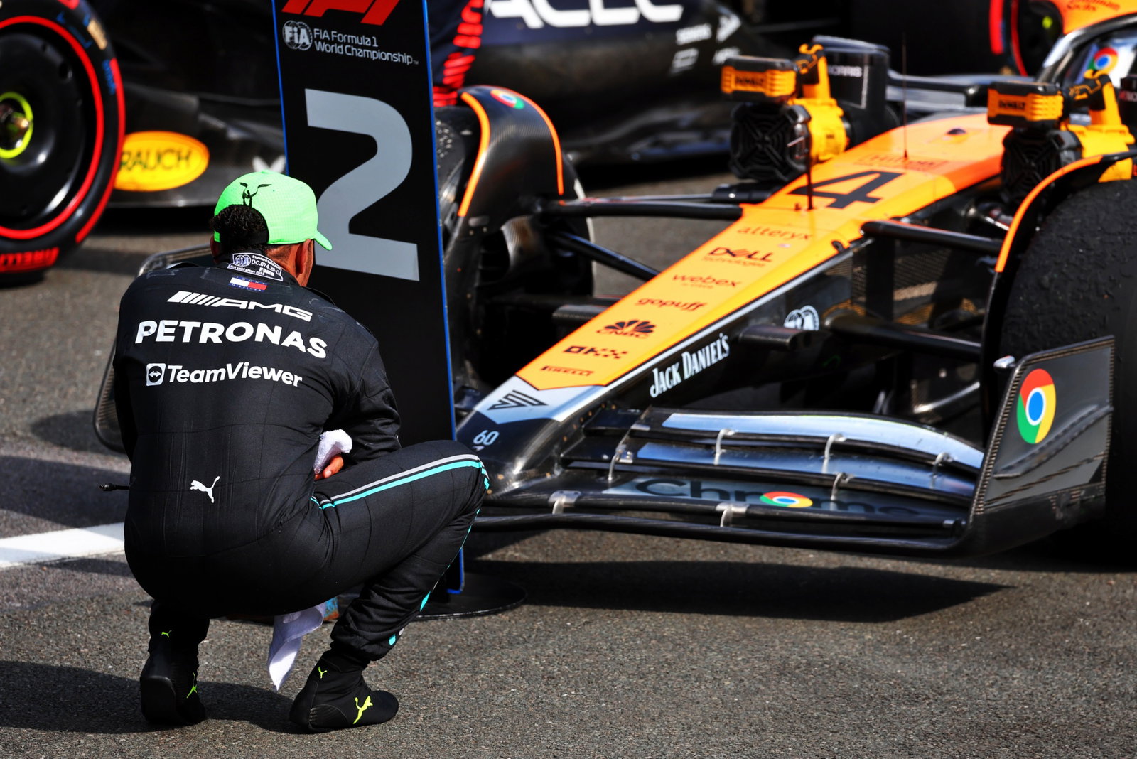 Lewis Hamilton (GBR) Mercedes AMG F1 W14 looks at the McLaren MCL60 in parc ferme. Formula 1 World Championship, Rd 11,