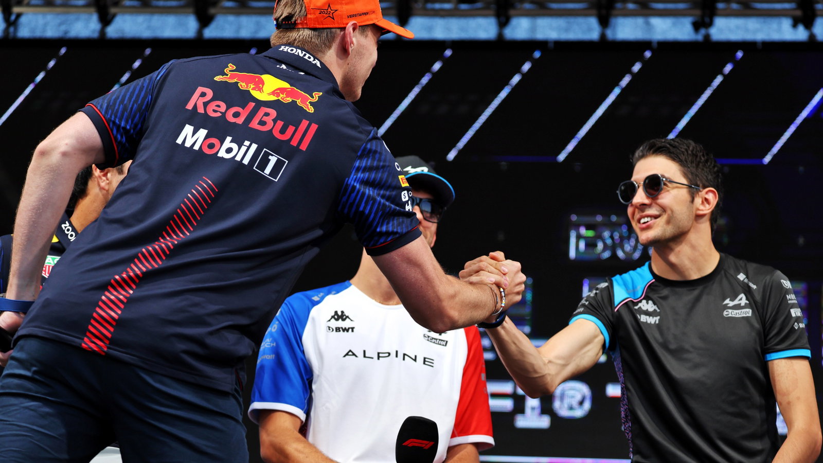 (L to R): Max Verstappen (NLD) Red Bull Racing and Esteban Ocon (FRA) Alpine F1 Team on the FanZone Stage. Formula 1 World