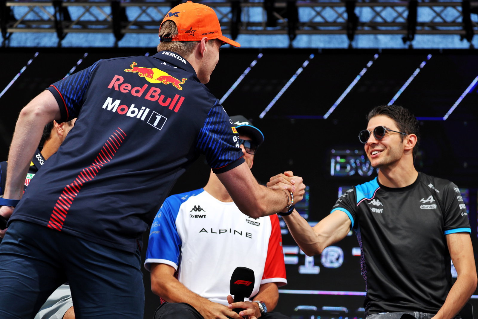(L to R): Max Verstappen (NLD) Red Bull Racing and Esteban Ocon (FRA) Alpine F1 Team on the FanZone Stage. Formula 1 World