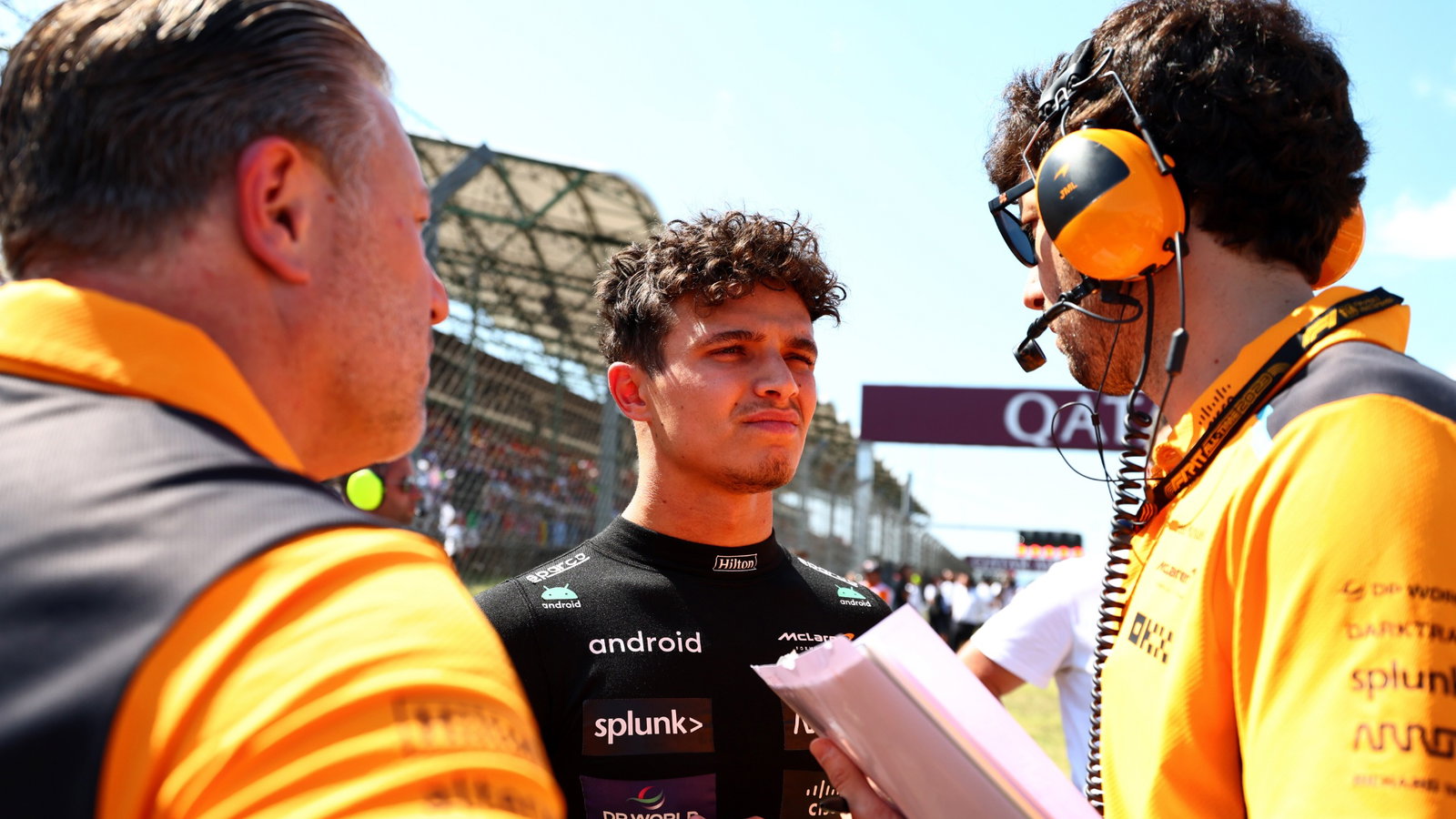 Lando Norris (GBR) McLaren with Jose Manuel Lopez Garcia (ESP) McLaren Lead Performance Engineer and Zak Brown (USA) McLaren