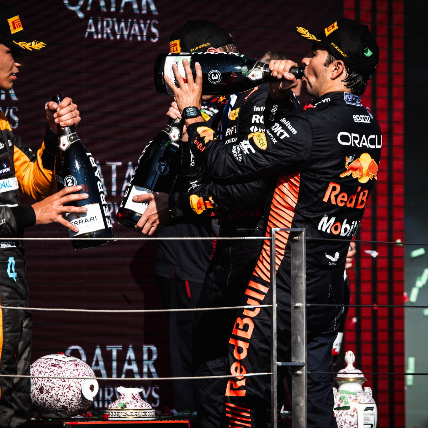 The podium (L to R): Lando Norris (GBR) McLaren, second; Max Verstappen (NLD) Red Bull Racing, race winner; Sergio Perez