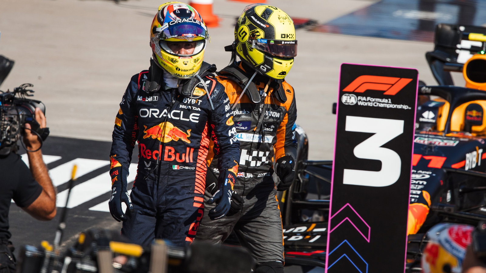 (L to R): third placed Sergio Perez (MEX) Red Bull Racing in parc ferme with second placed Lando Norris (GBR) McLaren.
