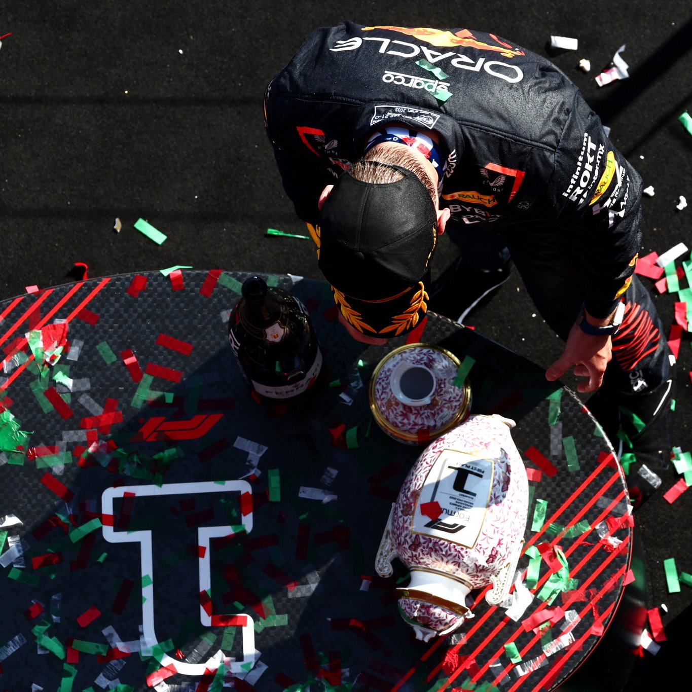 Max Verstappen (NLD) Red Bull Racing retrieves his broken trophy on the podium. Formula 1 World Championship, Rd 12,