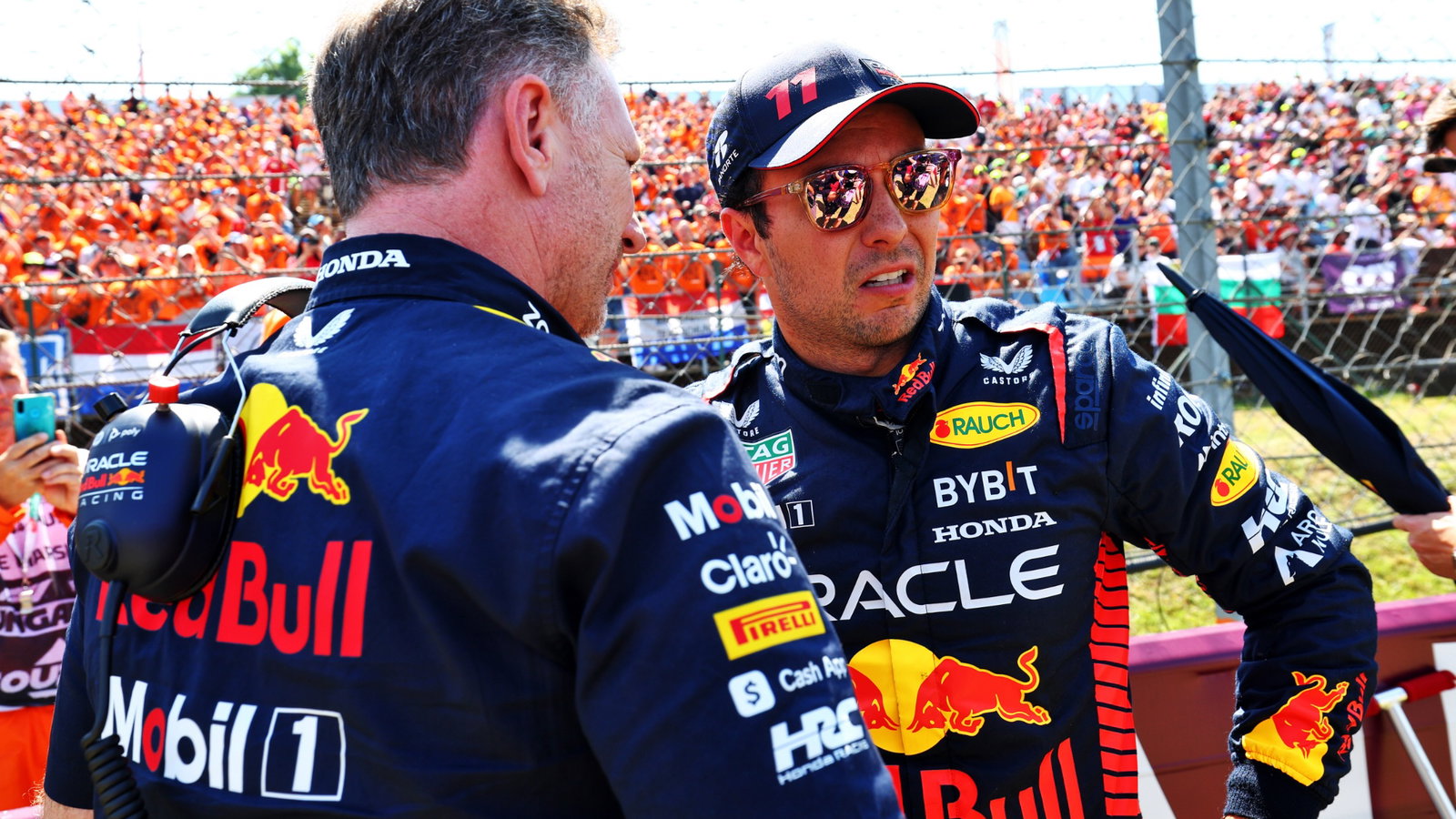 (L to R): Christian Horner (GBR) Red Bull Racing Team Principal with Sergio Perez (MEX) Red Bull Racing on the grid.
