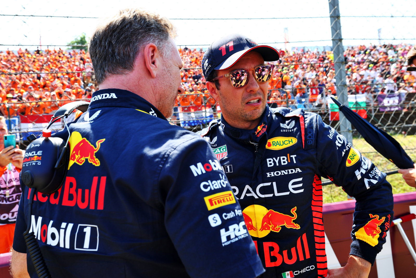 (L to R): Christian Horner (GBR) Red Bull Racing Team Principal with Sergio Perez (MEX) Red Bull Racing on the grid.
