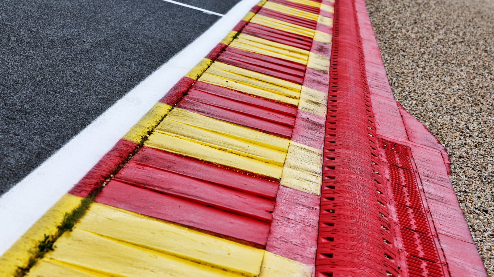 Circuit atmosphere - La Source exit kerb. Formula 1 World Championship, Rd 13, Belgian Grand Prix, Spa Francorchamps,