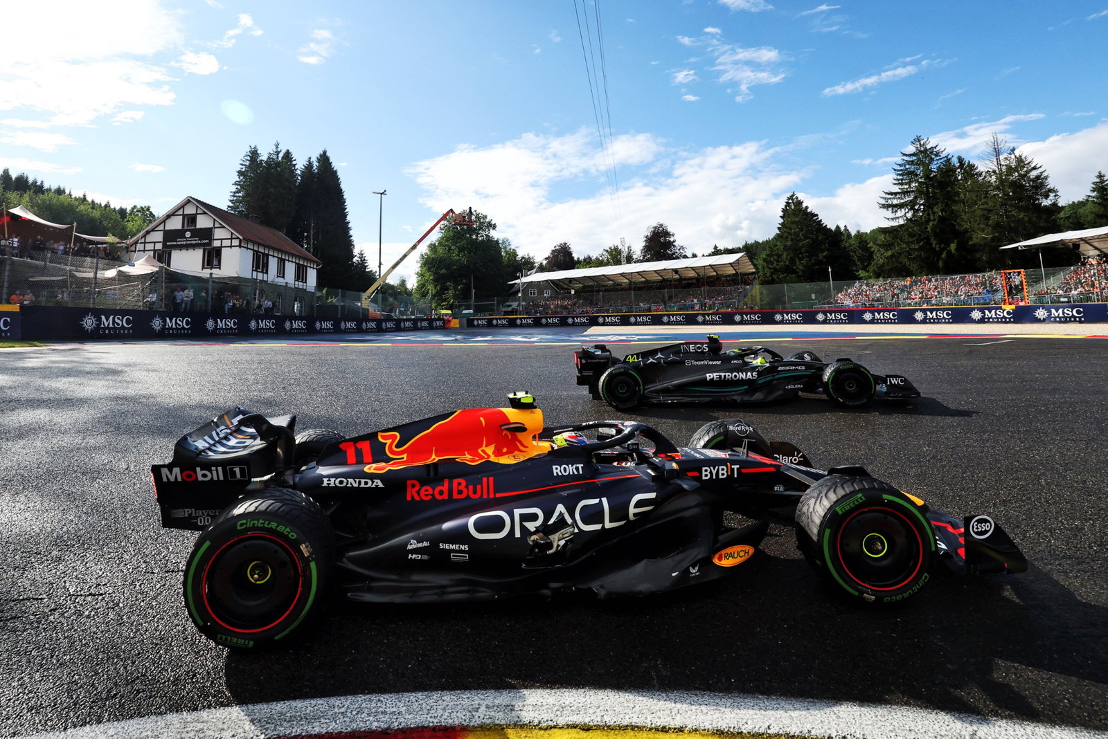 Sergio Perez (MEX) Red Bull Racing RB19 and Lewis Hamilton (GBR) Mercedes AMG F1 W14 battle for position. Formula 1 World