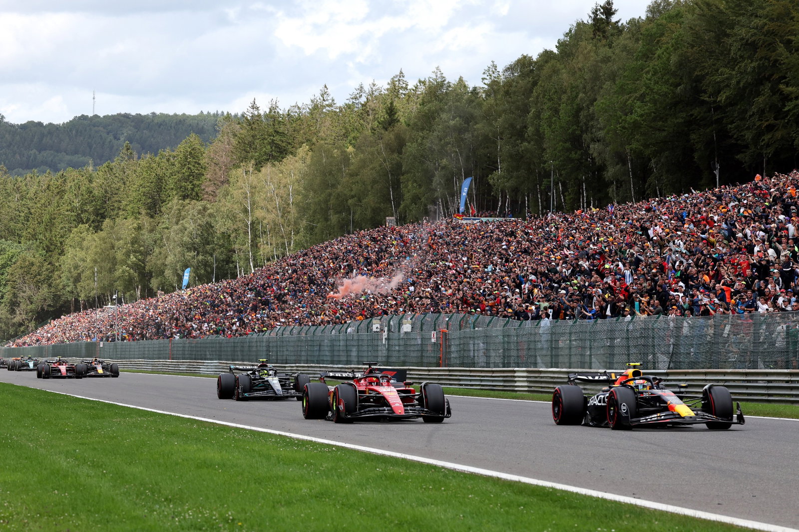 Charles Leclerc (MON) Ferrari SF-23 and Sergio Perez (MEX) Red Bull Racing RB19 battle at the start of the race. Formula 1
