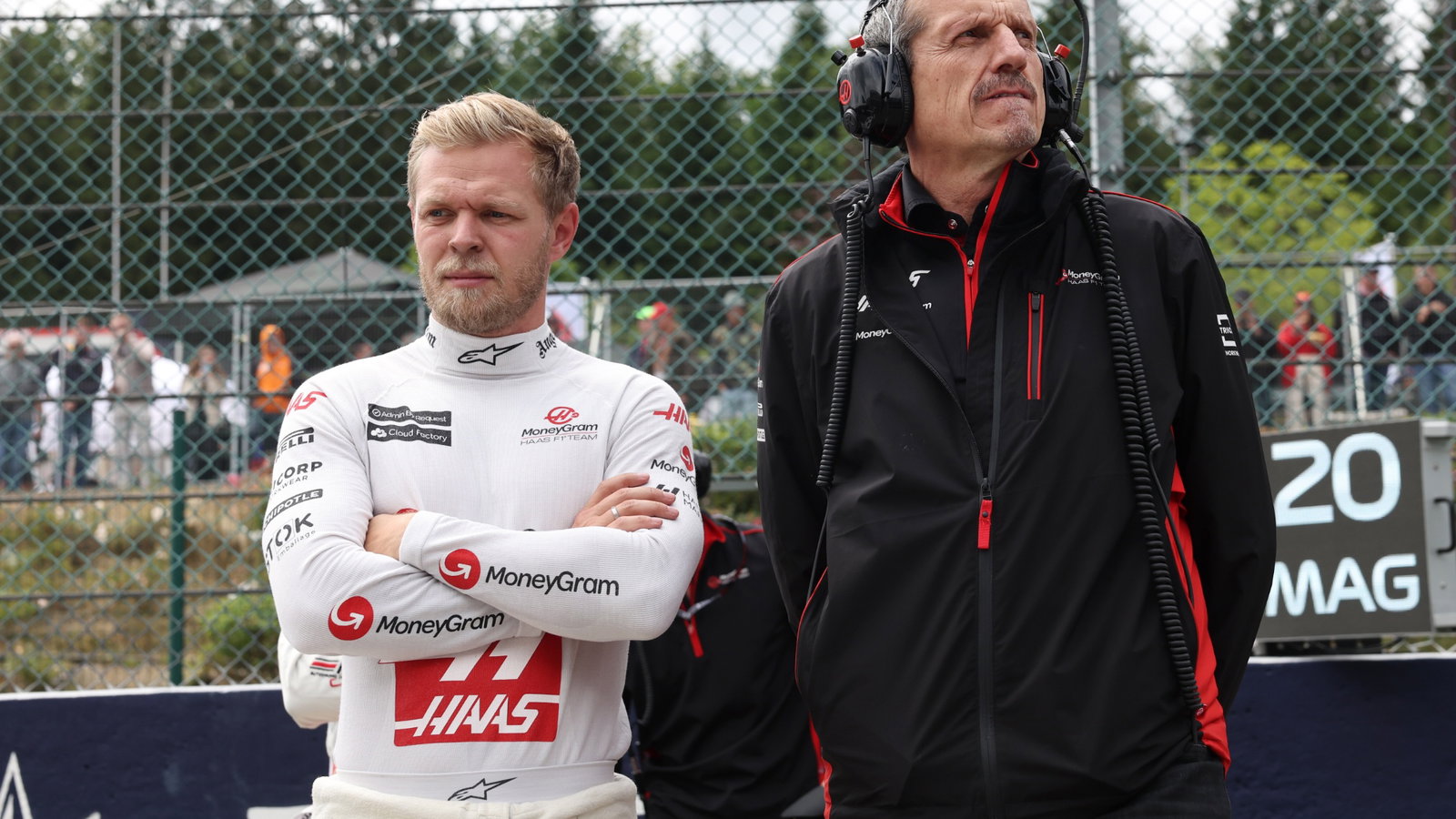 Toyota Gazoo Racing Kevin Magnussen (DEN) Haas F1 Team with Guenther Steiner (ITA) Haas F1 Team Prinicipal on the grid.
