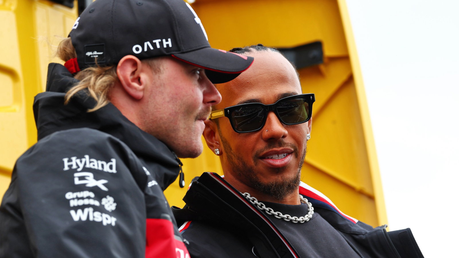 (L to R): Valtteri Bottas (FIN) Alfa Romeo F1 Team with Lewis Hamilton (GBR) Mercedes AMG F1 on the drivers' parade.
