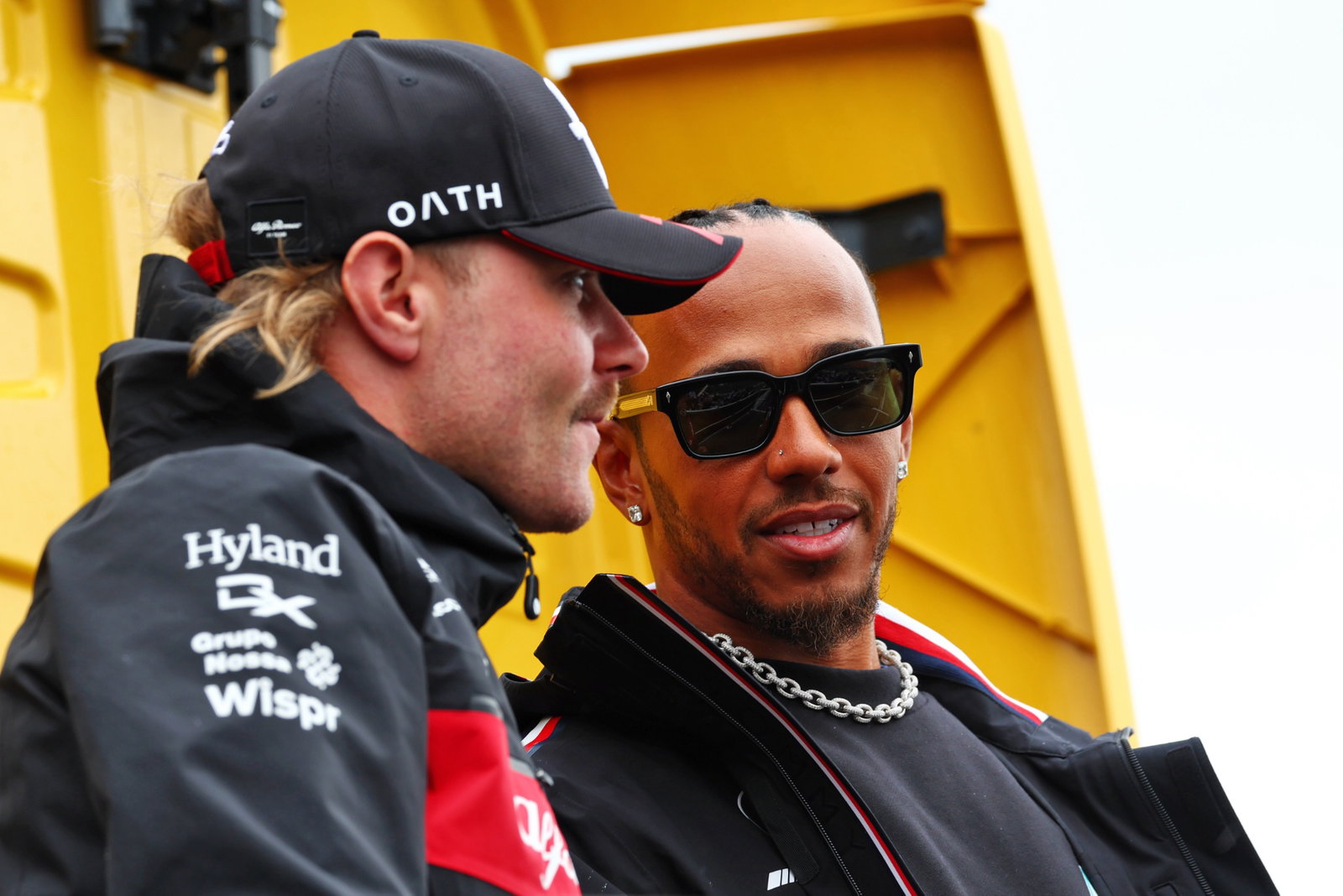 (L to R): Valtteri Bottas (FIN) Alfa Romeo F1 Team with Lewis Hamilton (GBR) Mercedes AMG F1 on the drivers' parade.
