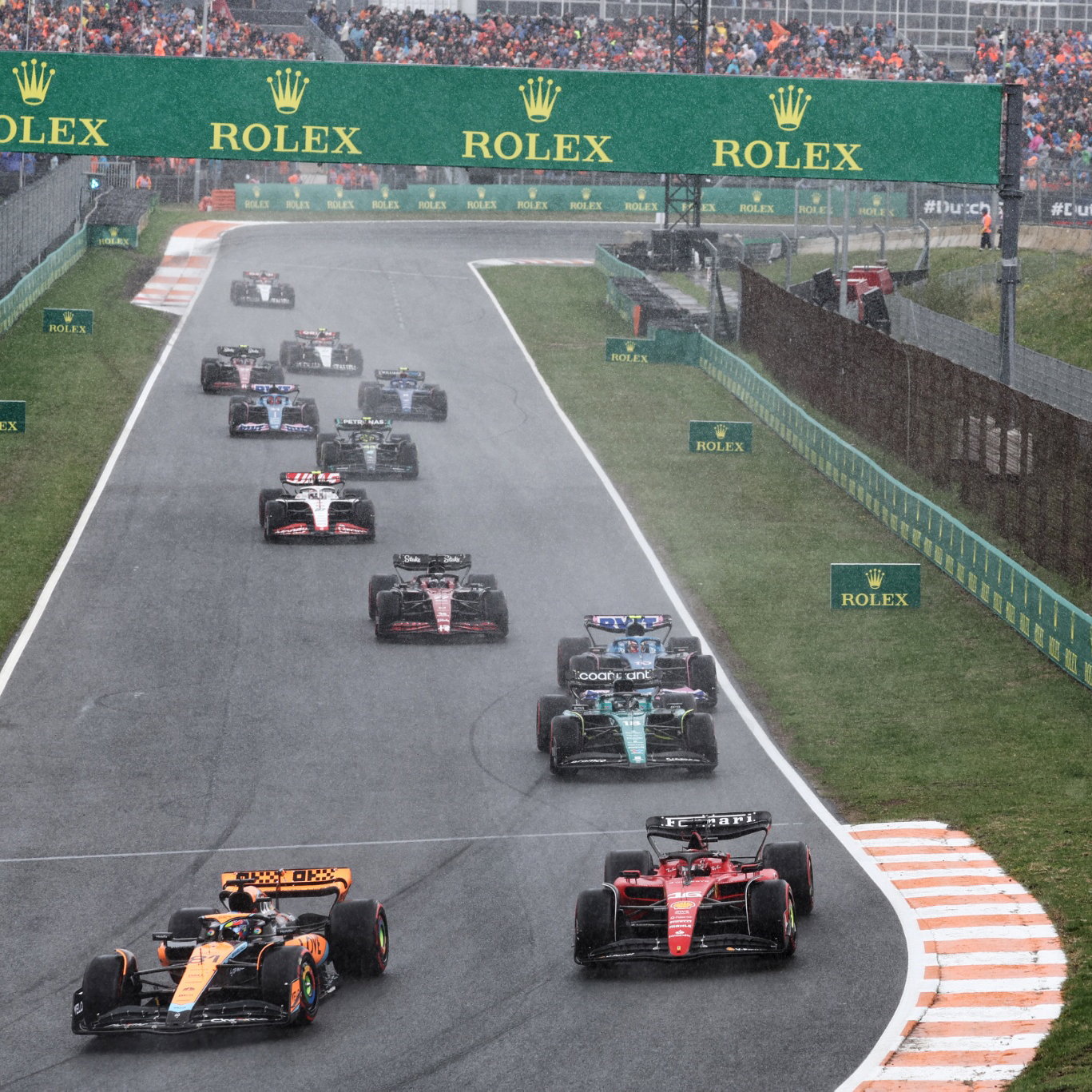(L to R): Oscar Piastri (AUS) McLaren MCL60 and Charles Leclerc (MON) Ferrari SF-23 battle for position at the start of the