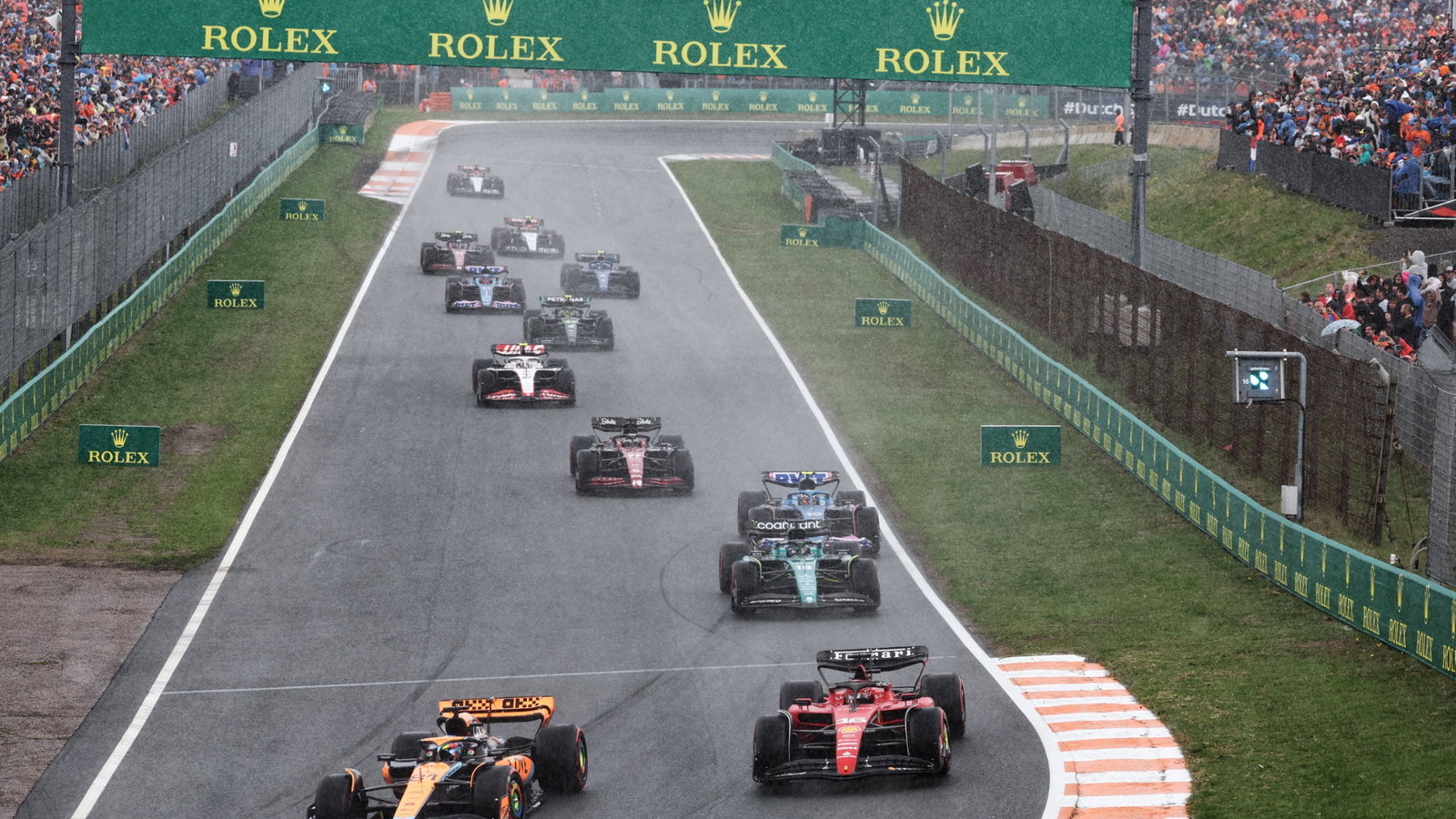 (L to R): Oscar Piastri (AUS) McLaren MCL60 and Charles Leclerc (MON) Ferrari SF-23 battle for position at the start of the