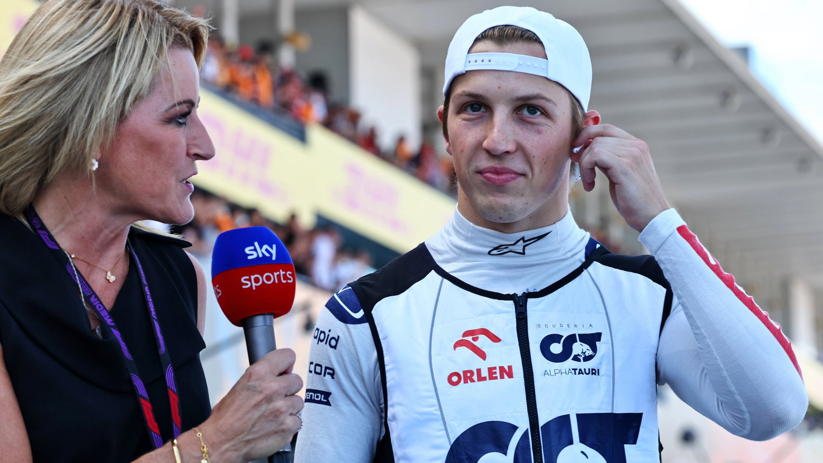 (L to R): Rachel Brookes (GBR) Sky Sports F1 Reporter with Liam Lawson (NZL) AlphaTauri on the grid. Formula 1 World