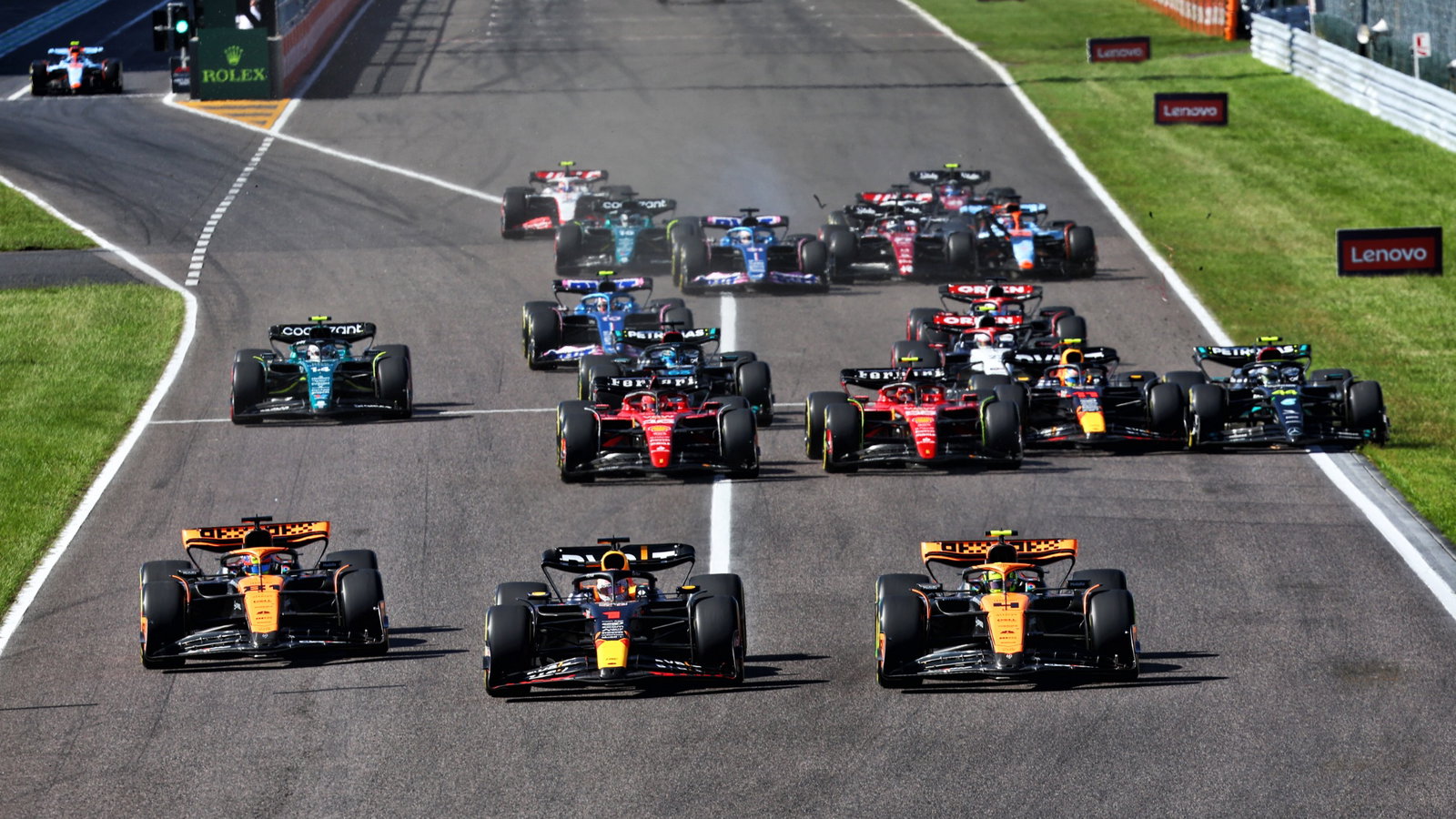 (L to R): Oscar Piastri (AUS) McLaren MCL60; Max Verstappen (NLD) Red Bull Racing RB19; and Lando Norris (GBR) McLaren MCL60