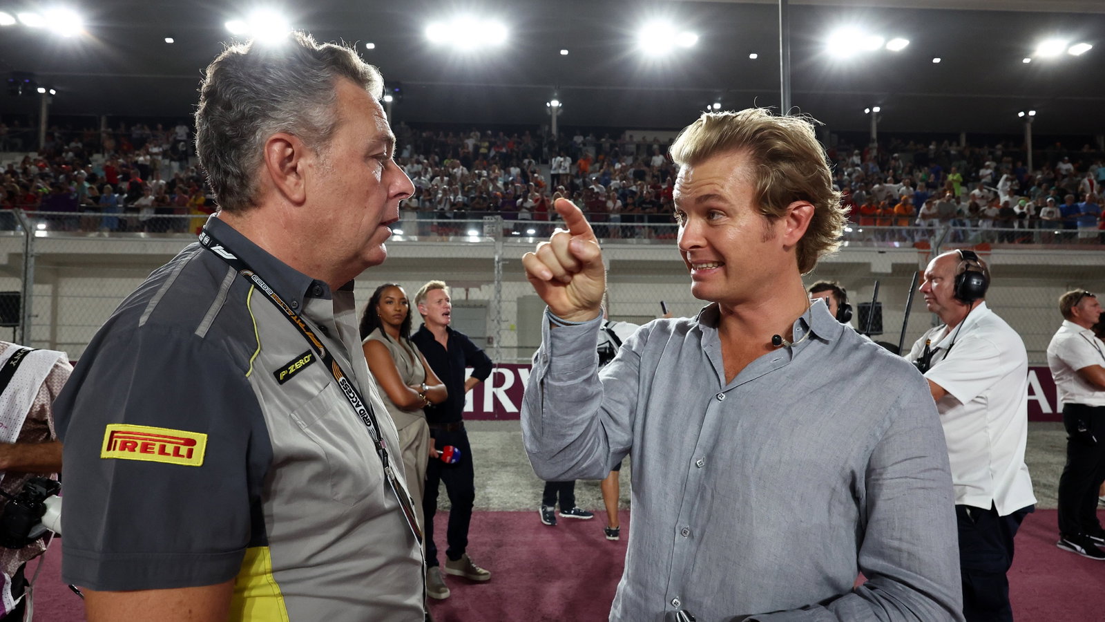 (L to R): Mario Isola (ITA) Pirelli Racing Manager with Nico Rosberg (GER). Formula 1 World Championship, Rd 18, Qatar