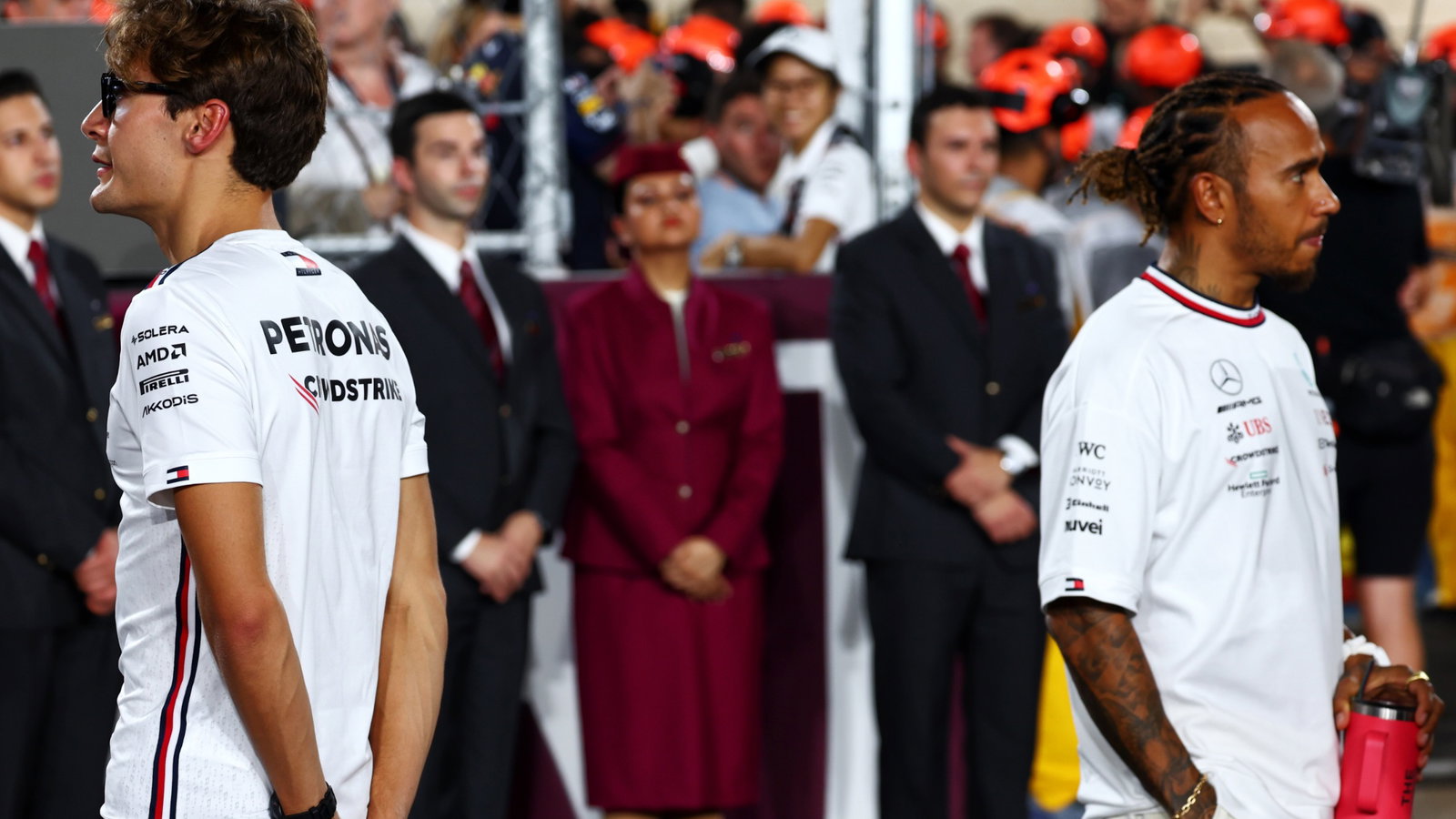(L to R): George Russell (GBR) Mercedes AMG F1 and Lewis Hamilton (GBR) Mercedes AMG F1 on the drivers' parade. Formula 1