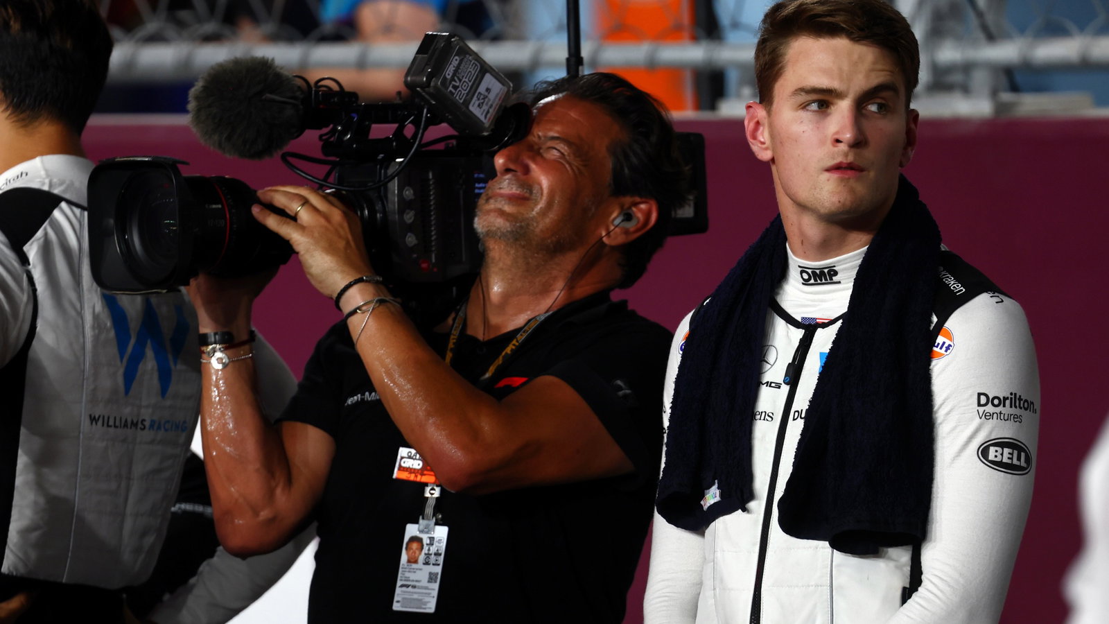 (L to R): Jean Michel Tibi (FRA) FOM Camera Operator with Logan Sargeant (USA) Williams Racing on the grid. Formula 1