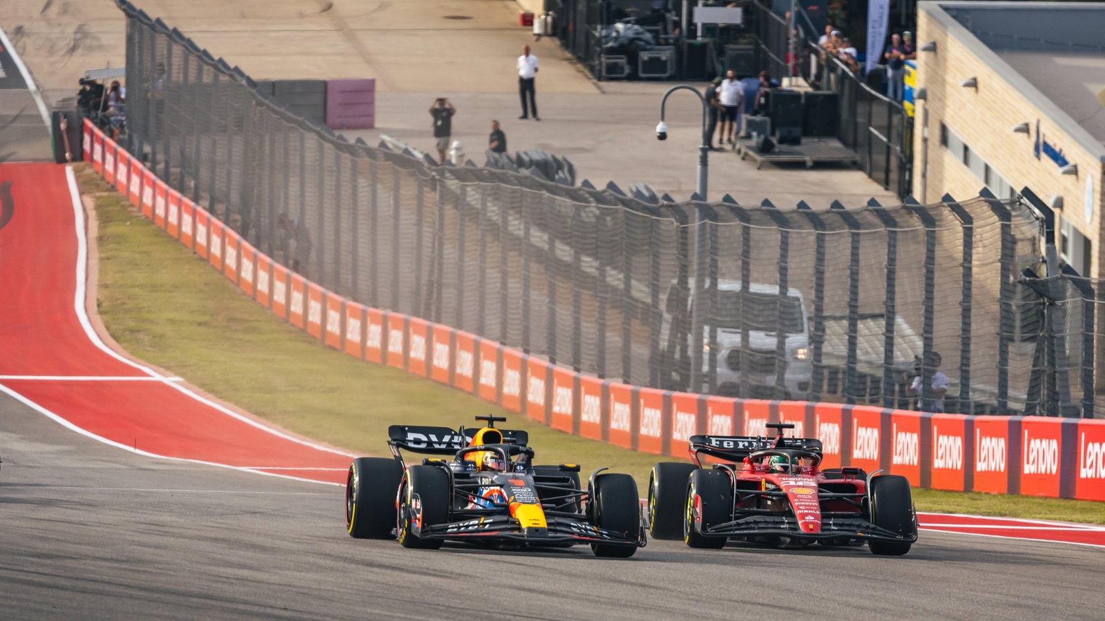 Max Verstappen (NLD) Red Bull Racing RB19 leads Charles Leclerc (MON) Ferrari SF-23 at the start of Sprint. Formula 1